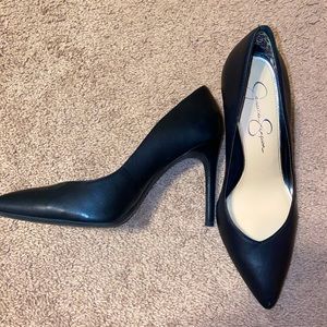 Black faux leather pumps by Jessica Simpson
